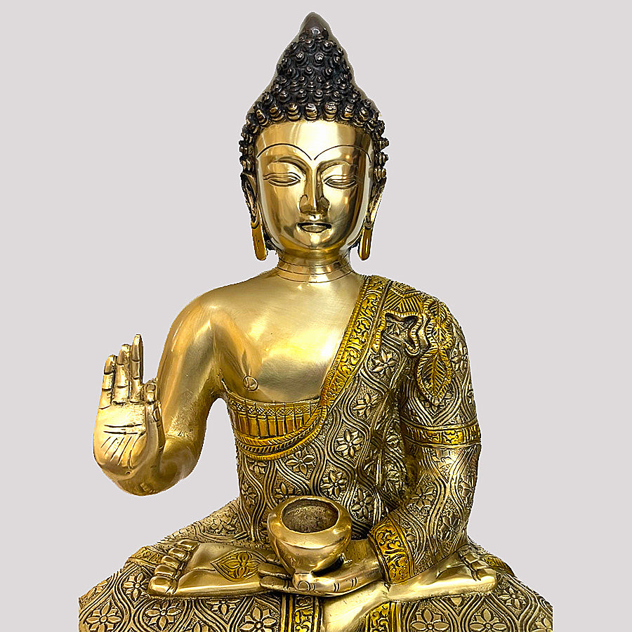 BRASS MEDITATING BUDDHA HOLDING VITARKA MUDRA SEATED ON A PEDASTAL