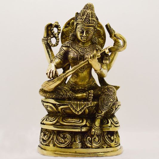 BRASS SARAWATI SITTING WITH FLOWER BASE