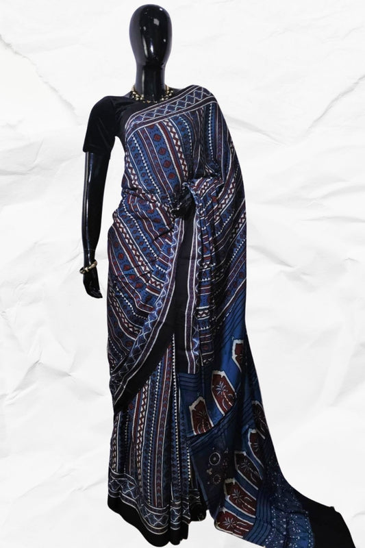 Mannequin wearing a blue and black patterned dress on a white background