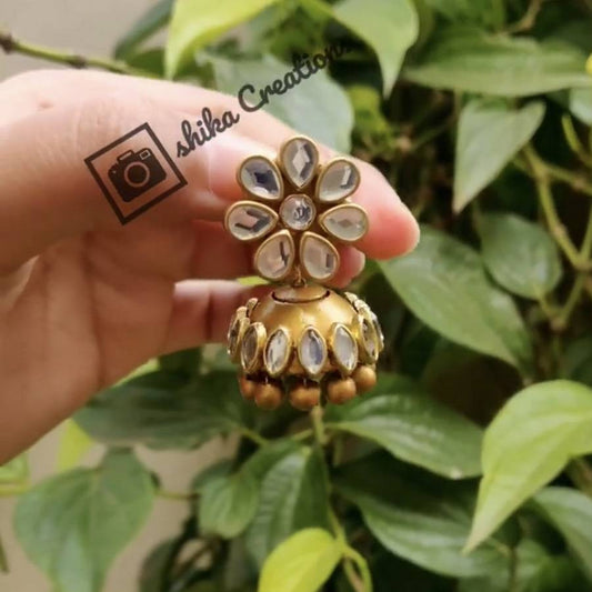 TERRACOTTA JHUMKA WITH KUNDHAN STONE EMBELLISHMENTS. COLOURS: GOLD