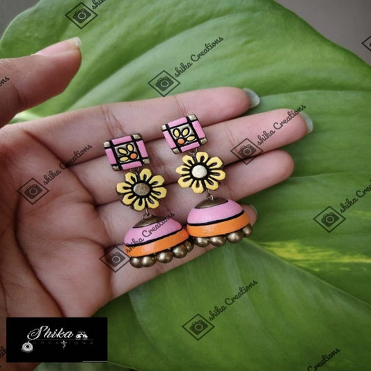 TERRACOTTA STEP JHUMKAS. COLOURS: PATEL PINK,PASTEL ORANGE, ANTIQUE BRONZE AND PASTEL YELLOW