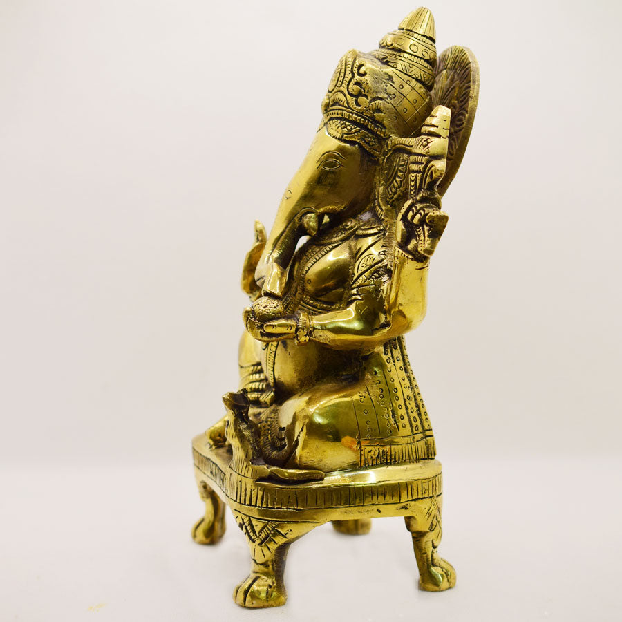 TRADITIONAL BRASS GANESHA SITTING ON LION FEET STAND